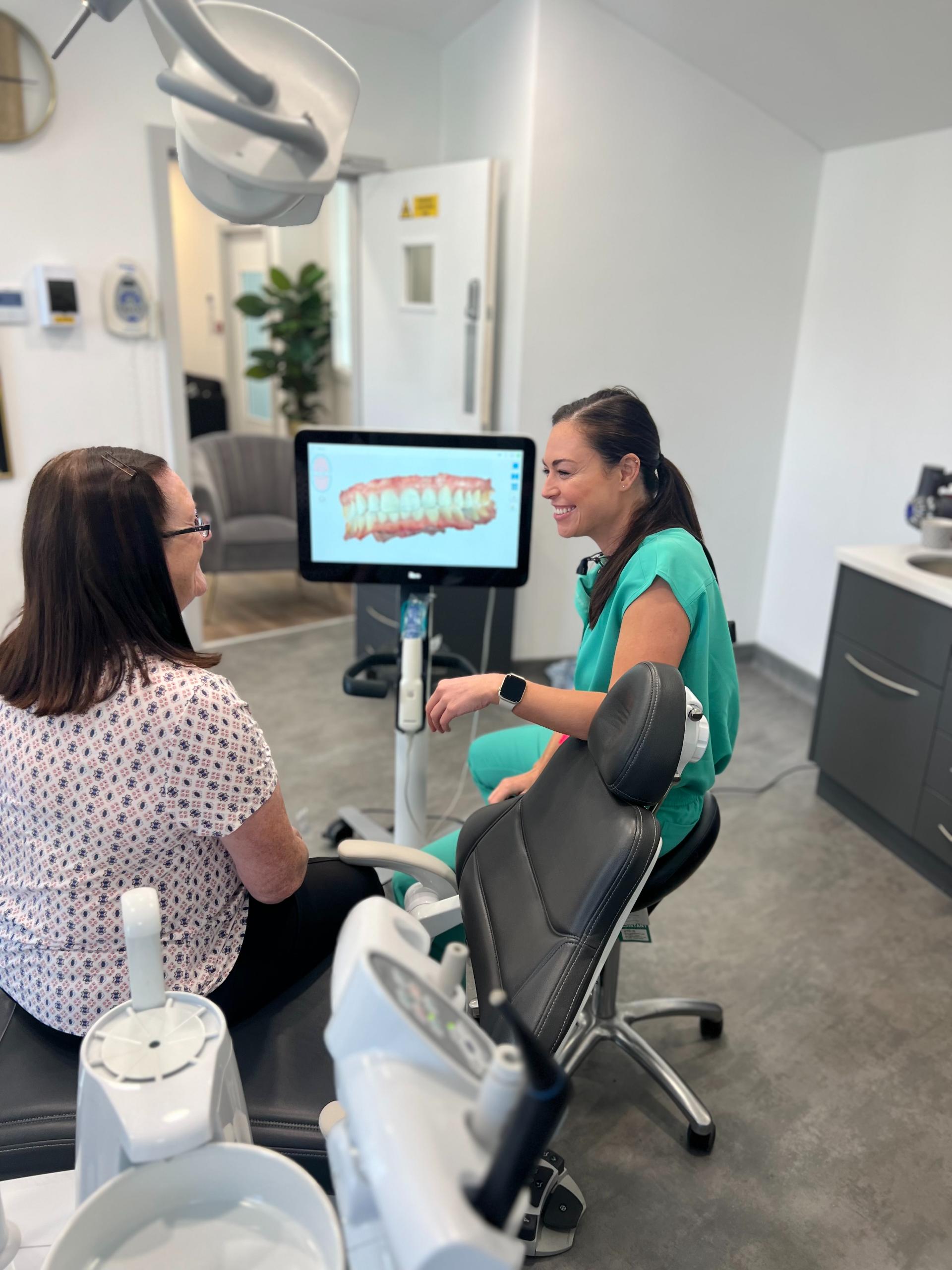 Dentist discussing with patient